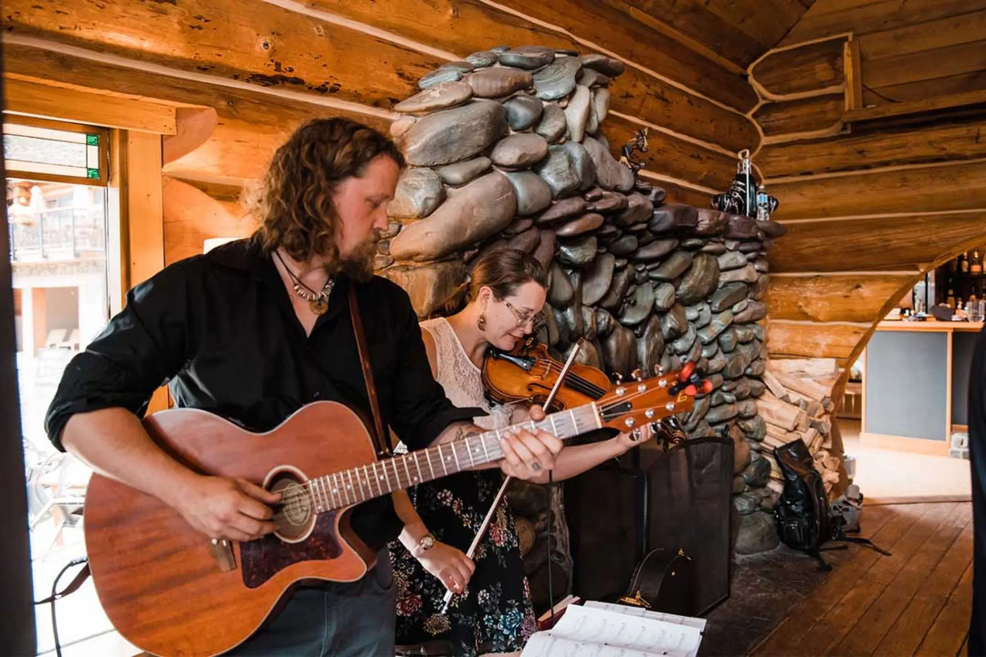 Music beside the stone fireplace in Bear Lodge