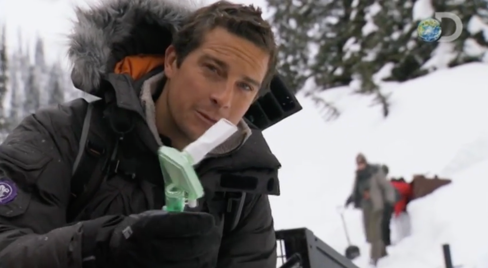 Bear Grylls in the snowy forest preparing for the Buried Alive sequence in Man vs. Wild