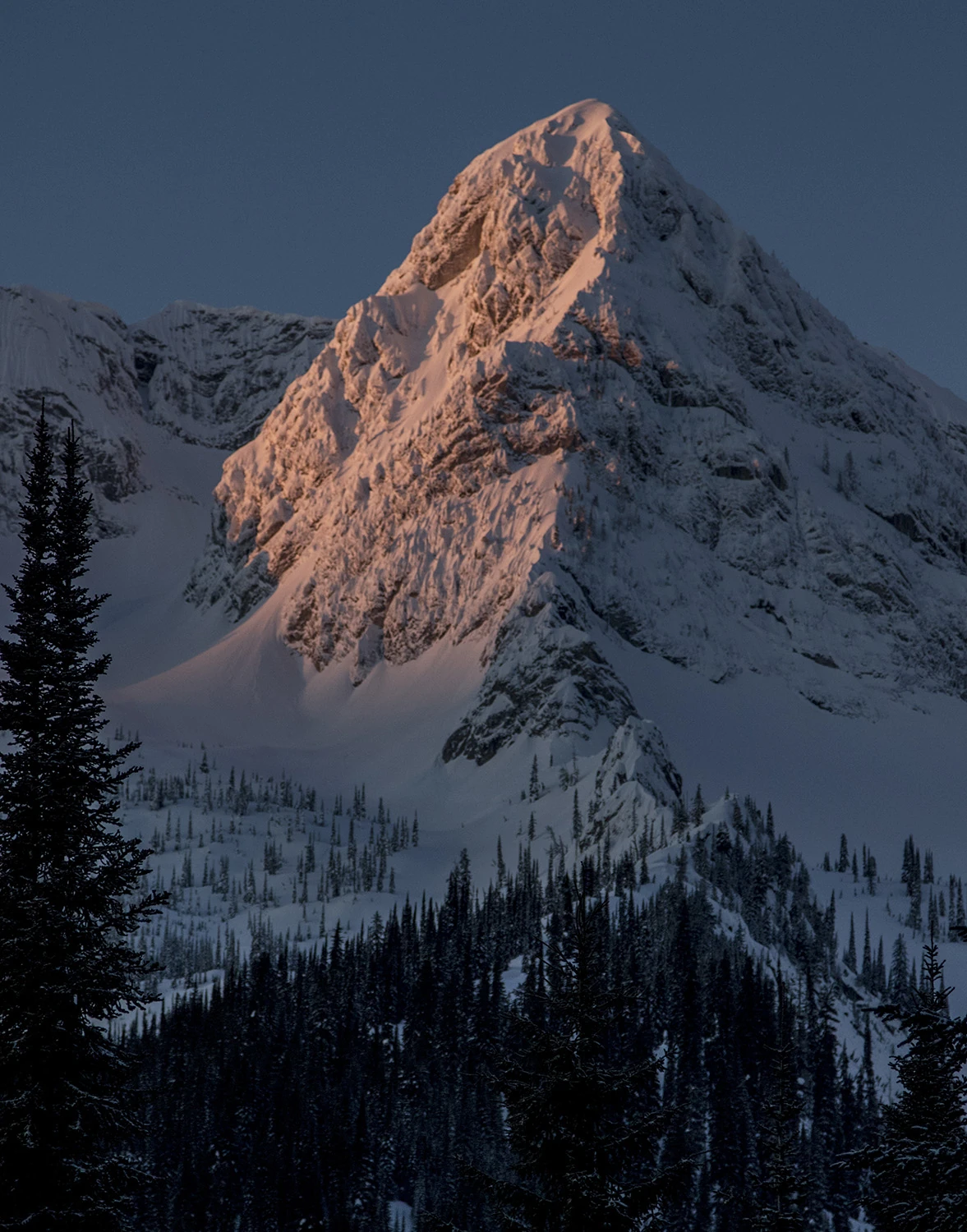 Last light on a snow-covered peak in the Lizard Range