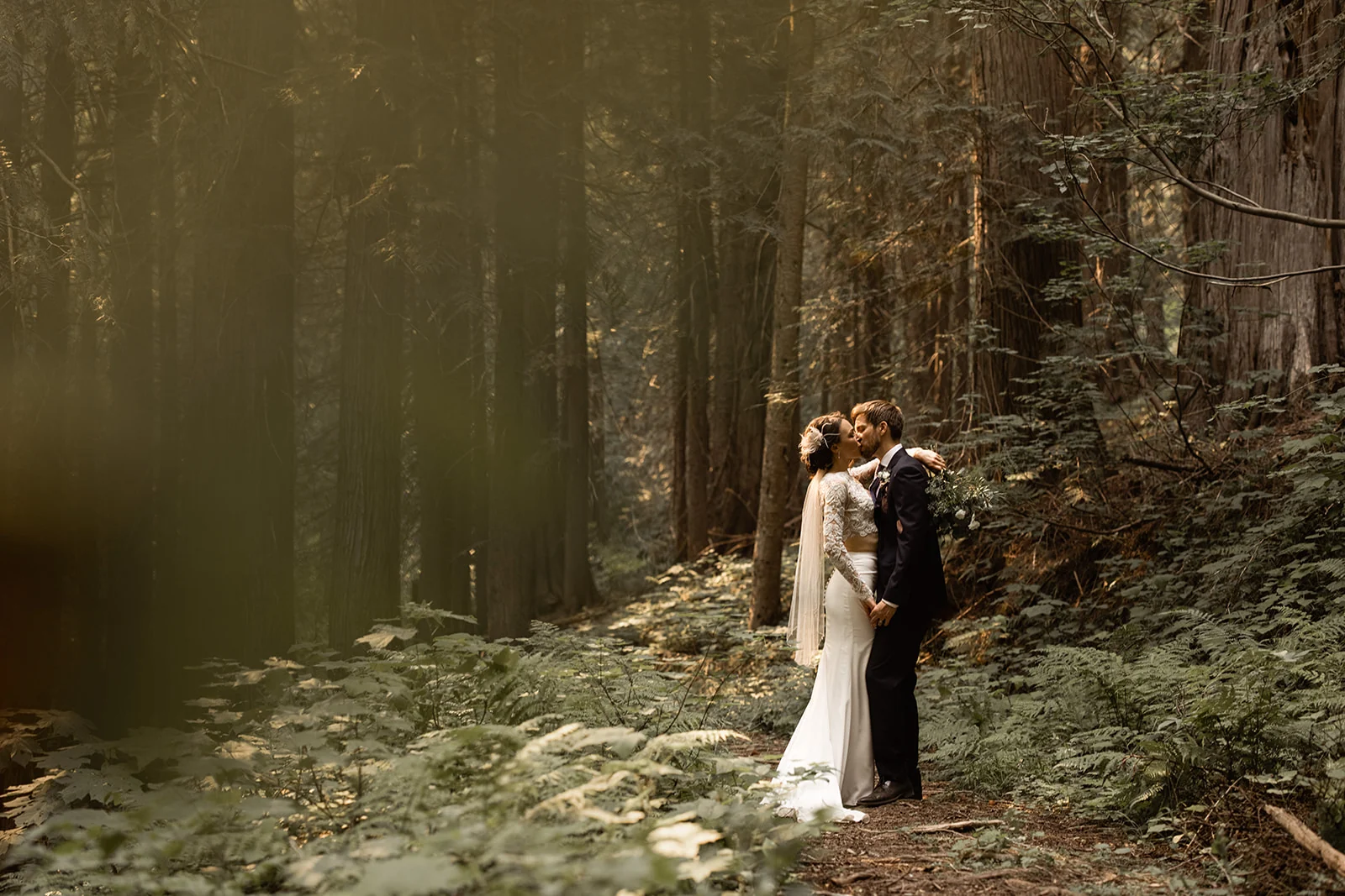 A wedding couple among the trees